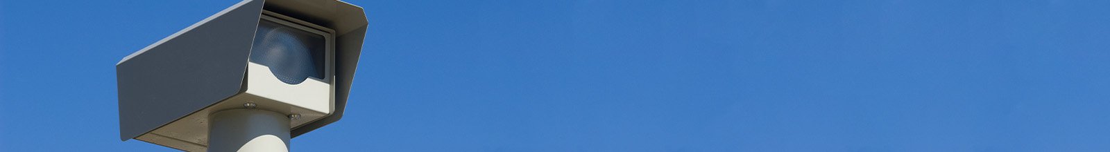 Speed camera against a blue sky