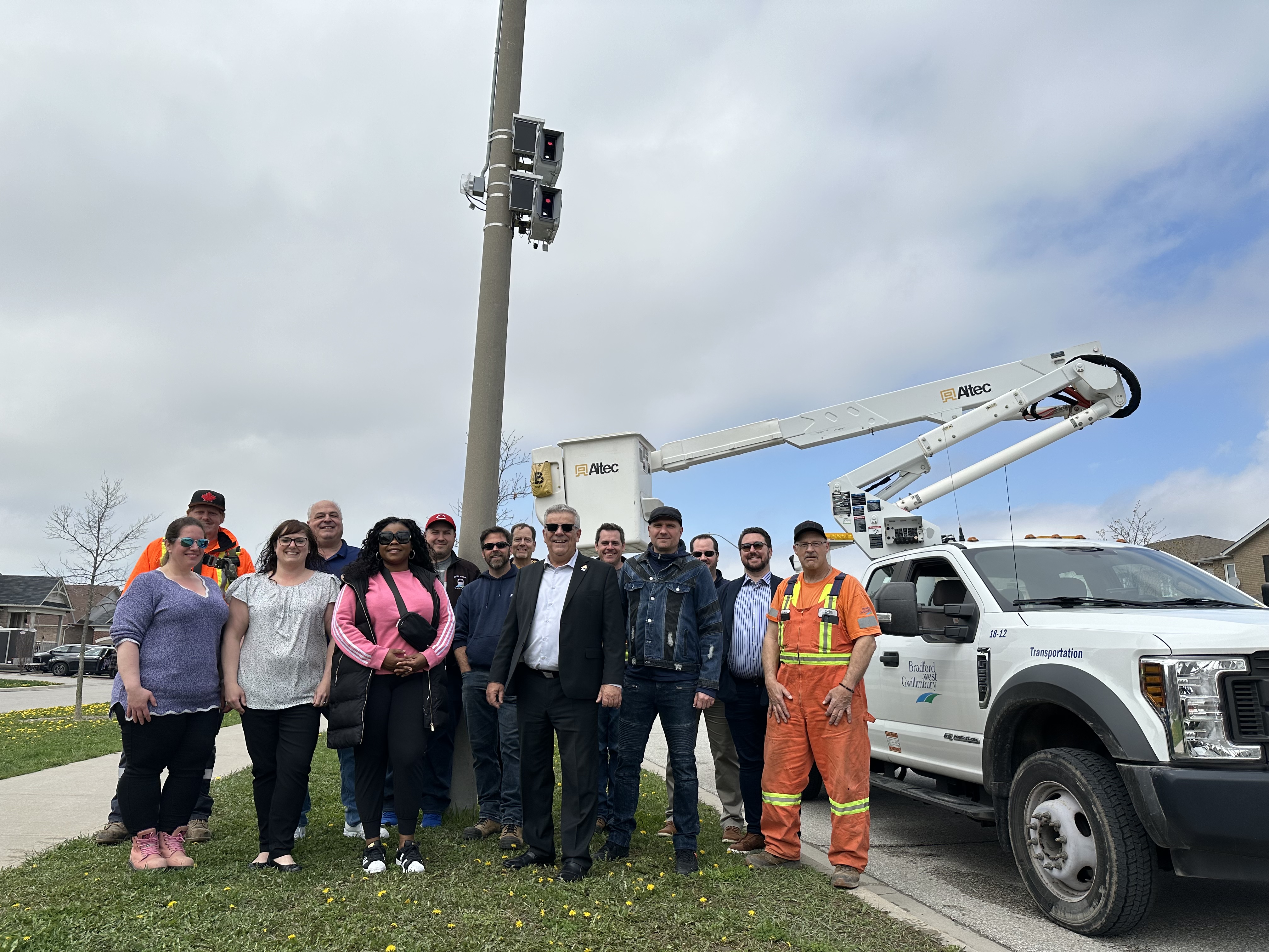 Town Council, Mayor James Leduc and Town staff standing outside a new speed enforcement camera