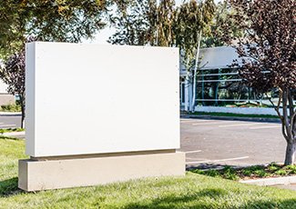 Blank company signboard in front of an office building