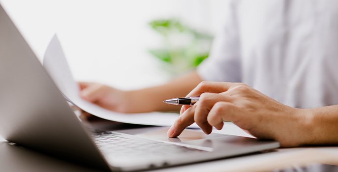 Photo of person completing a file search on their computer