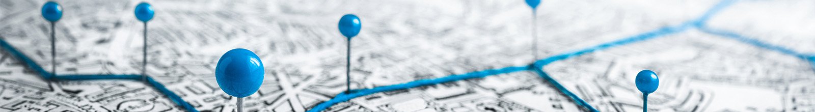 Blue pins marking a map