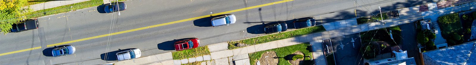 image of cars on suburban street