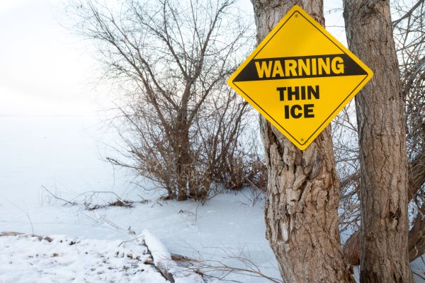 outdoor ice with sign 'warning, thin ice'