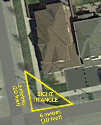 Ariel view of a corner lot home with outline of a slight triangle