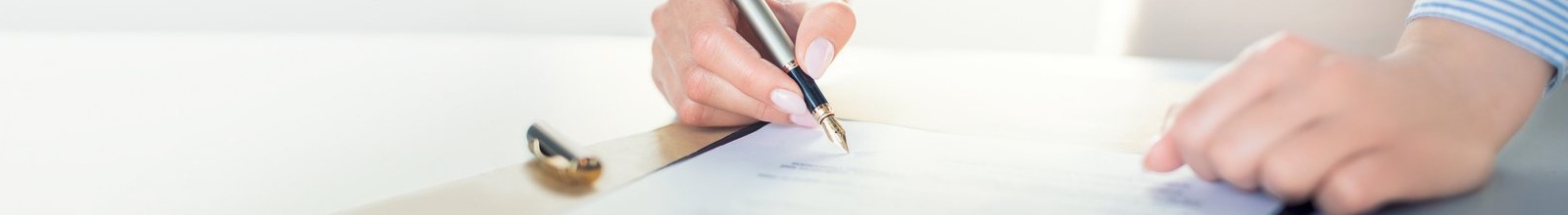 person signing a document