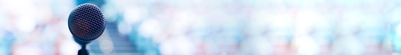 Up close photo of microphone on stage