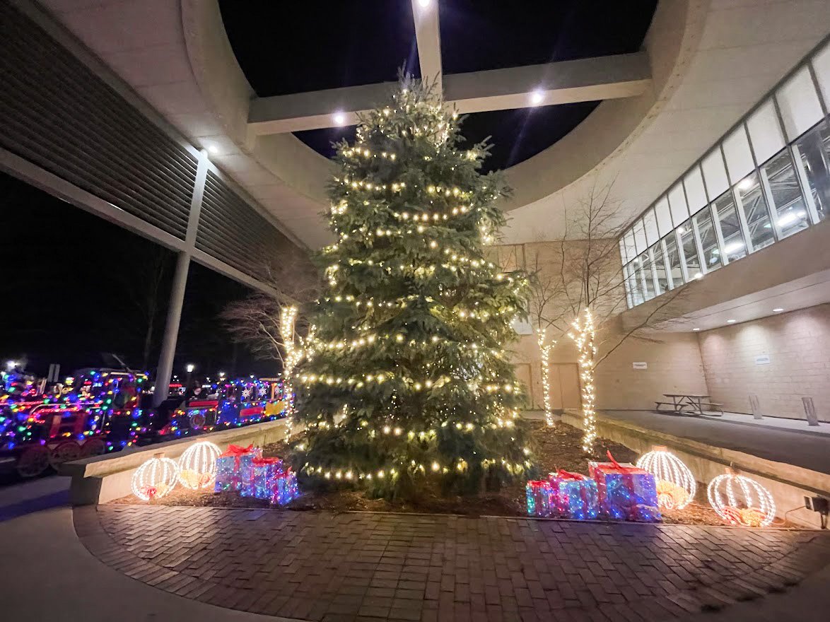 Tall Christmas tree outside of the BWG Leisure Centre with lights and light up floor Christmas ornaments 