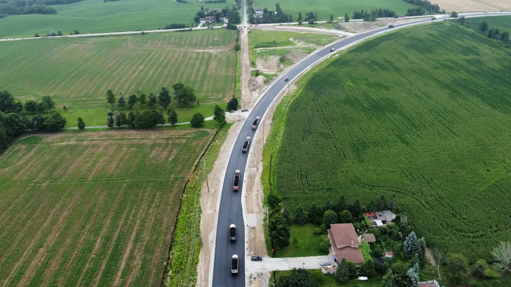 August 2023: Paving operations on Sideroad 10 looking south towards Line 5.