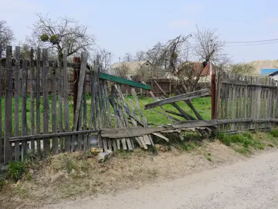 Unkept property with broken fence