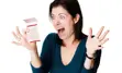 Elated woman reacts to her winning lottery ticket