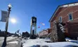 Exterior view of BWG's Finance building and the court house courtyard and clock tower on Holland Street East