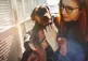 Photo of Kennel owner holding a dog in her arms